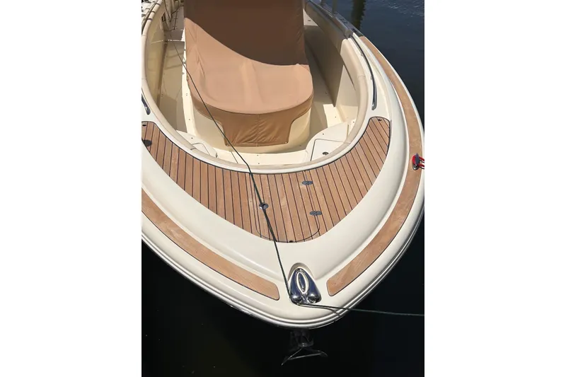 Slide: The Image of 2018 Chris-Craft Catalina 30 boat with teak deck and covered seating area. - 3