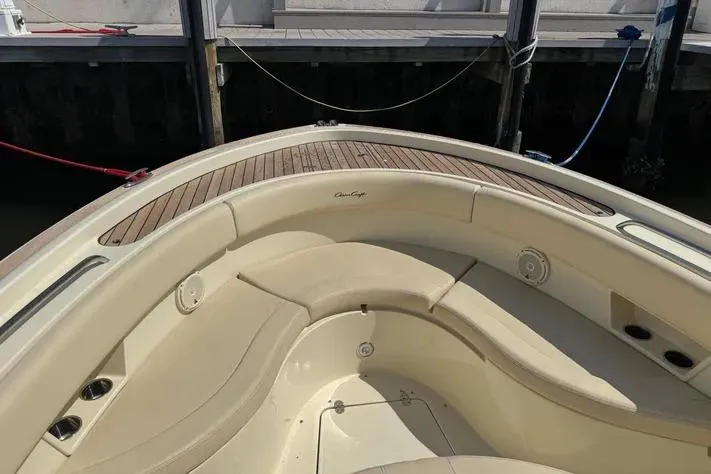 Slide: The Image of 2018 Chris-Craft Catalina 30 boat with elegant seating and wooden deck details. - 38