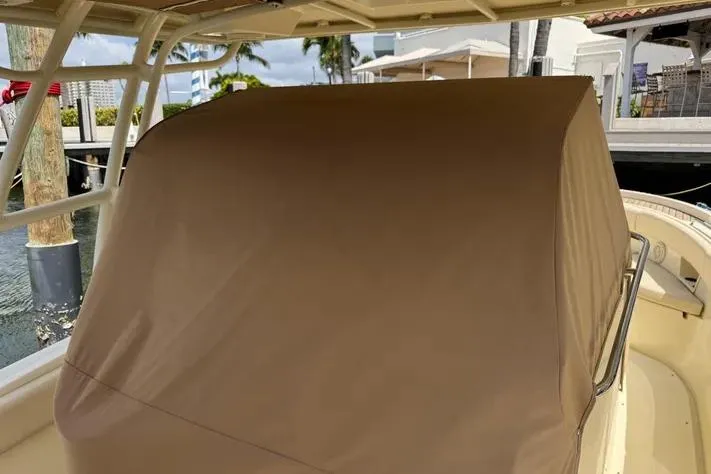 Slide: The Image of 2018 Chris-Craft Catalina 30 boat with covered console, docked near waterfront homes. - 39