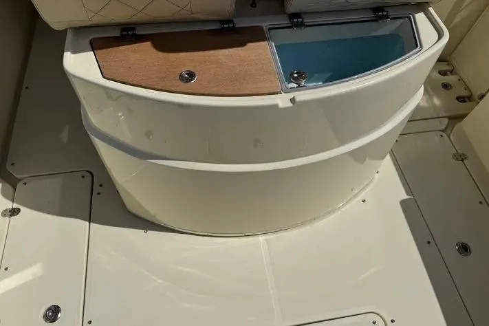 Slide: The Image of 2018 Chris-Craft Catalina 30 boat interior with storage compartments and seating. - 6