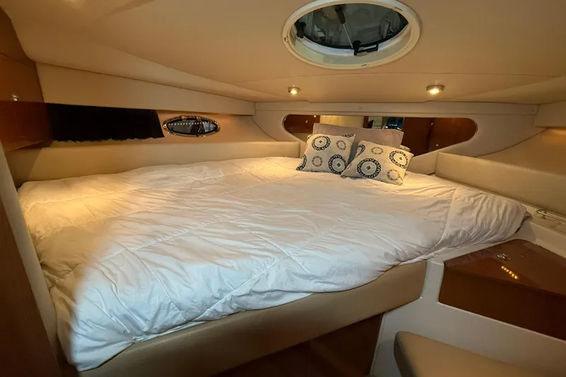 Slide: The Image of Luxurious cabin interior of 2007 Regal Commodore 3760 IO yacht with cozy bedding. - 20