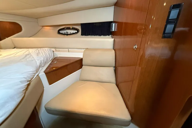 Slide: The Image of Interior of 2007 Regal Commodore 3760 IO yacht with beige seating and wood paneling. - 21