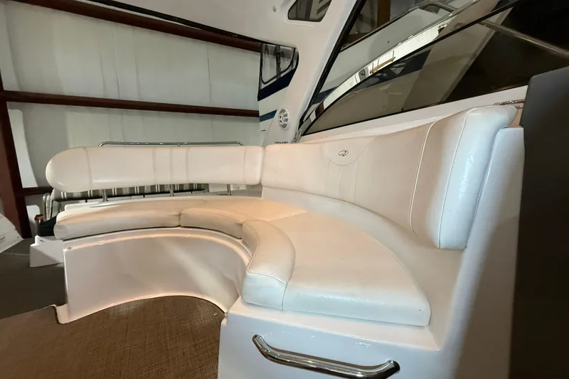 Slide: The Image of 2007 Regal Commodore 3760 IO boat interior with white leather seating. - 25