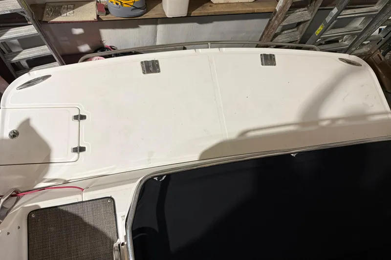 Slide: The Image of 2007 Regal Commodore 3760 IO boat deck, white surface with storage hatch. - 28