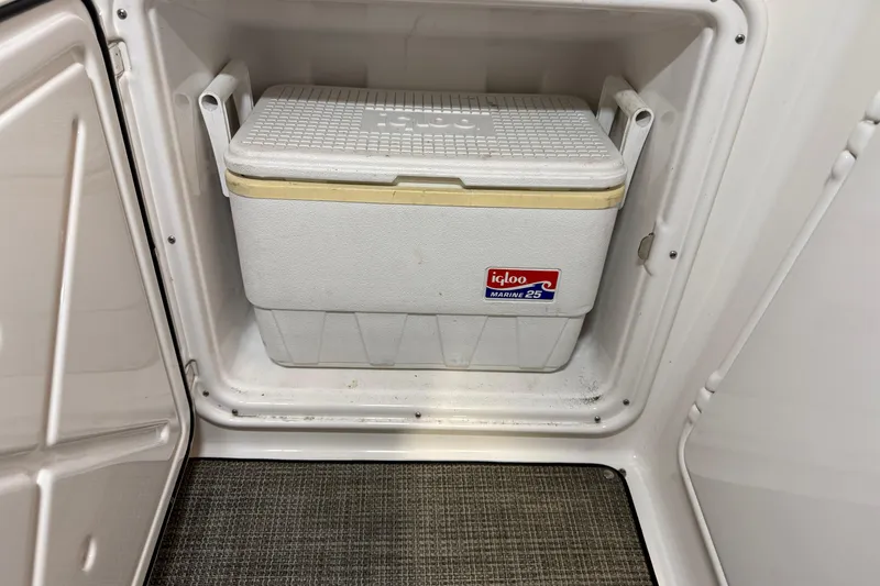 Slide: The Image of Igloo Marine 25 cooler inside 2007 Regal Commodore 3760 IO storage compartment. - 31