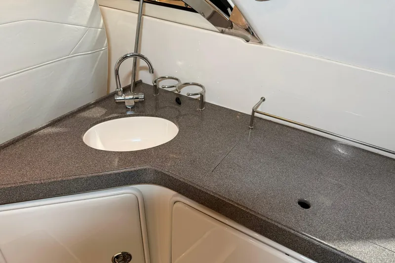 Slide: The Image of 2007 Regal Commodore 3760 IO boat interior with sleek countertop and sink. - 34