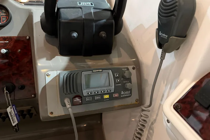 Slide: The Image of 2007 Regal Commodore 3760 IO boat dashboard with Cobra GPS and radio system. - 35