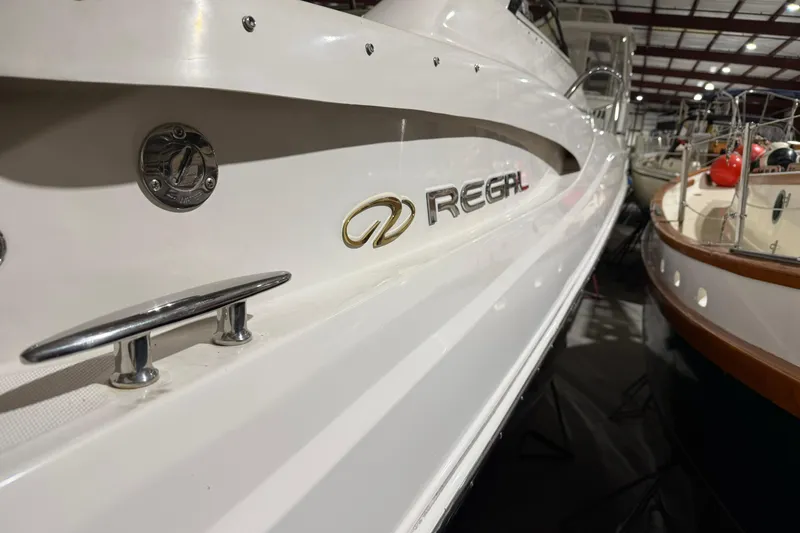 Slide: The Image of 2007 Regal Commodore 3760 IO boat in storage, showcasing sleek design and branding. - 42