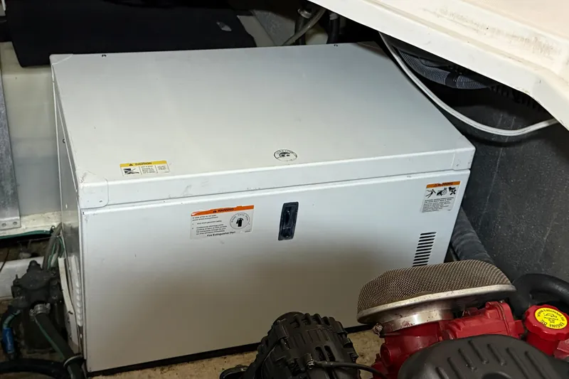 Slide: The Image of Engine compartment of a 2007 Regal Commodore 3760 IO boat, featuring machinery and components. - 46