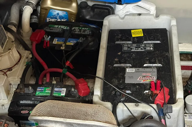 Slide: The Image of Engine compartment of 2007 Regal Commodore 3760 IO with batteries and coolant container. - 47