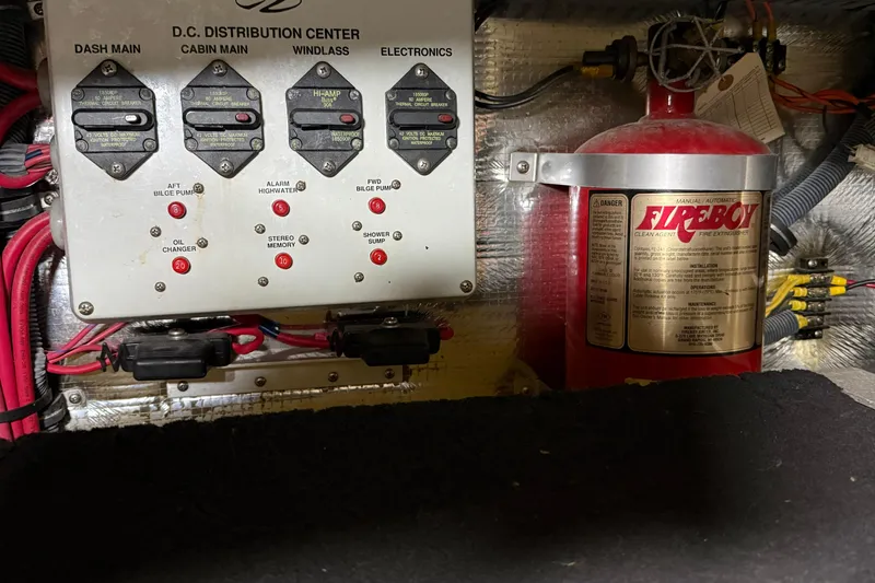 Slide: The Image of Electrical panel and fire extinguisher in 2007 Regal Commodore 3760 IO boat. - 49