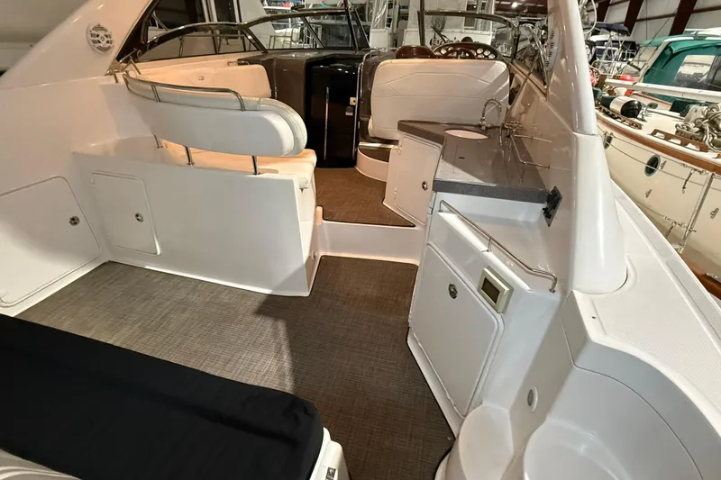 Slide: The Image of 2007 Regal Commodore 3760 IO boat interior with seating and kitchenette. - 5