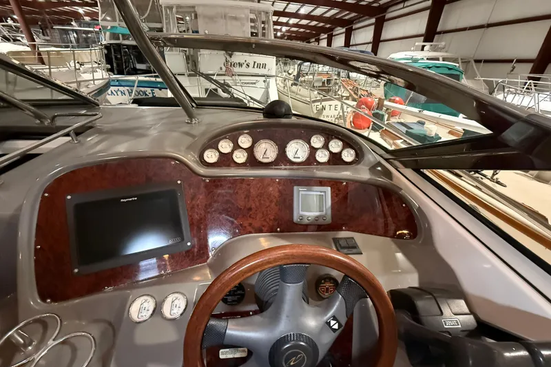 Slide: The Image of 2007 Regal Commodore 3760 IO boat dashboard with gauges and navigation system. - 8