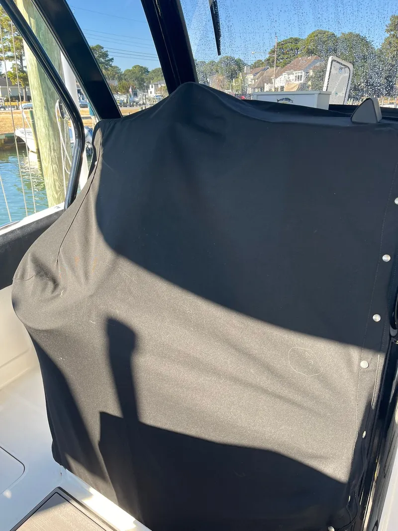 Slide: The Image of Covered seat on a 2023 World Cat 280 CC-X boat. - 14