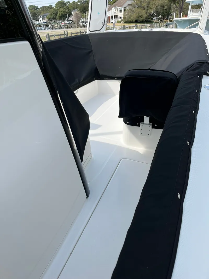 Slide: The Image of Interior of 2023 World Cat 280 CC-X boat with black cover. - 16
