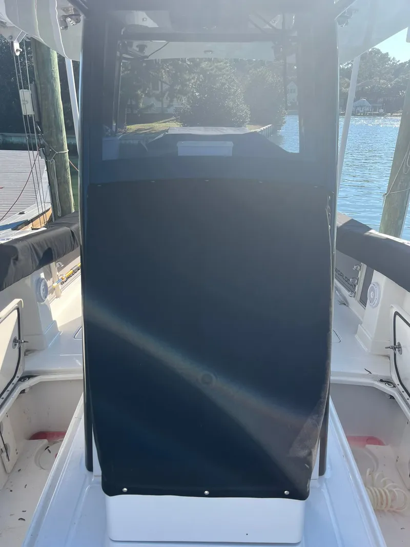 Slide: The Image of 2023 World Cat 280 CC-X boat cockpit view at dock. - 17