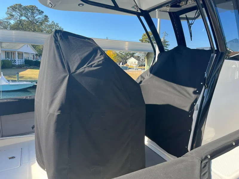 Slide: The Image of Covered seats on a 2023 World Cat 280 CC-X boat. - 21