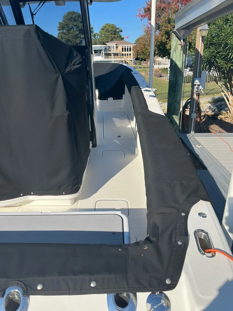 Slide: The Image of 2023 World Cat 280 CC-X boat with black cover. - 22