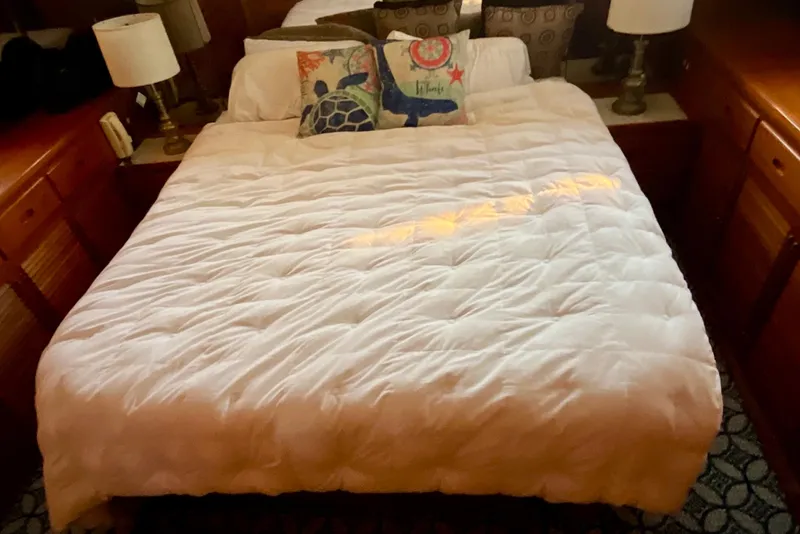 Slide: The Image of Cozy bedroom in 1987 Lien Hwa 47 Cockpit Motor Yacht with nautical-themed pillows. - 10