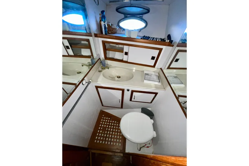 Slide: The Image of Bathroom interior of 1987 Lien Hwa 47 Cockpit Motor Yacht with sink and toilet. - 11
