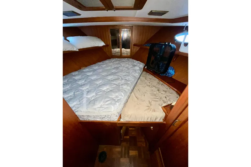 Slide: The Image of 1987 Lien Hwa 47 Cockpit Motor Yacht cabin with bed and wooden interior. - 18
