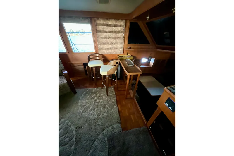 Slide: The Image of Interior of 1987 Lien Hwa 47 Cockpit Motor Yacht with seating and windows. - 8
