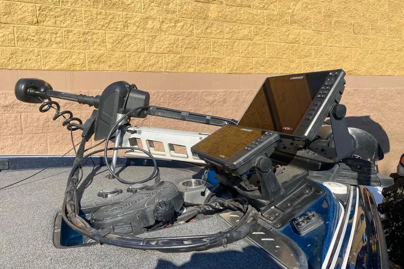 Slide: The Image of 2020 Triton 20 TrX Patriot boat dashboard with advanced navigation equipment. - 10