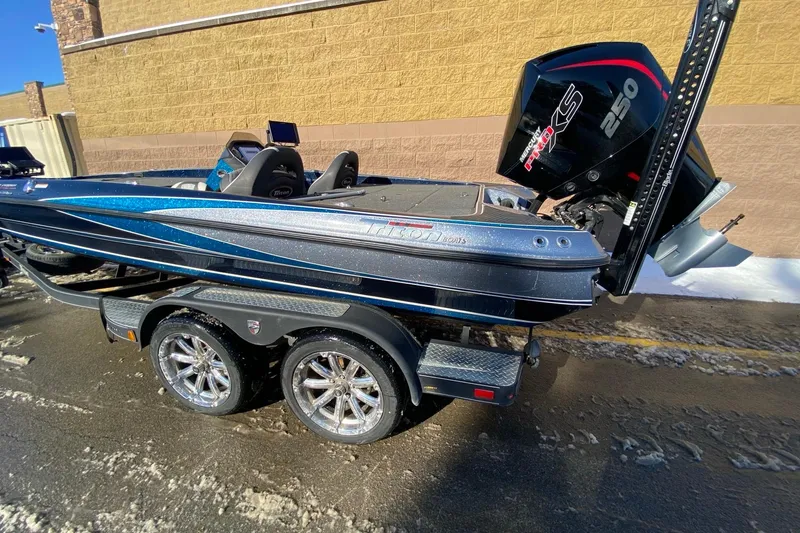 Slide: The Image of 2020 Triton 20 TrX Patriot boat with Mercury Pro XS 250 engine on trailer. - 4
