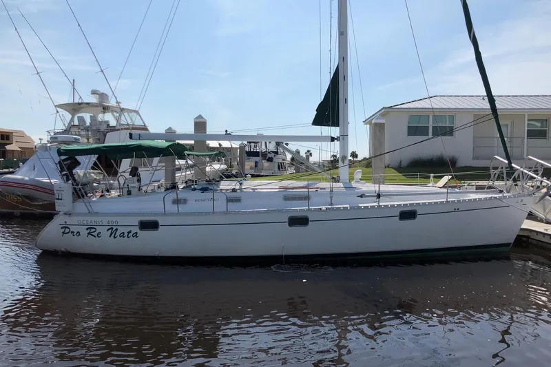 The Image of 1994 Beneteau Oceanis 400 sailboat docked at marina, side view. - 0