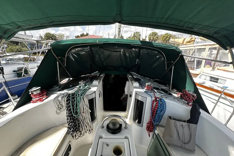 Slide: The Image of Cockpit of 1994 Beneteau Oceanis 400 sailboat with ropes and canopy. - 11