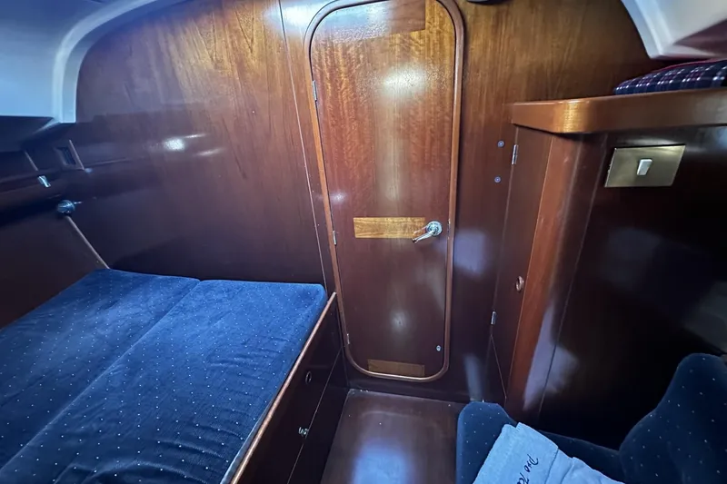 Slide: The Image of Cozy cabin interior of 1994 Beneteau Oceanis 400 sailboat with wooden finish. - 29