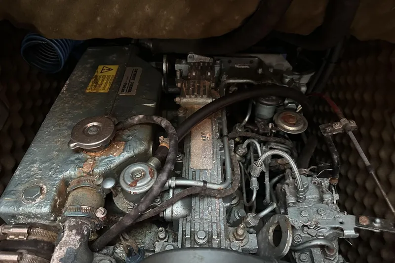 Slide: The Image of Engine compartment of a 1994 Beneteau Oceanis 400 sailboat, showing detailed mechanical components. - 39