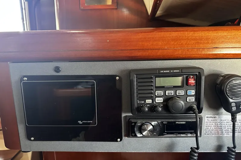 Slide: The Image of Control panel of a 1994 Beneteau Oceanis 400 sailboat with radio and display. - 40