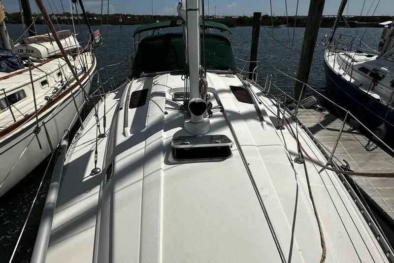Slide: The Image of 1994 Beneteau Oceanis 400 sailboat docked, showcasing deck and rigging details. - 45