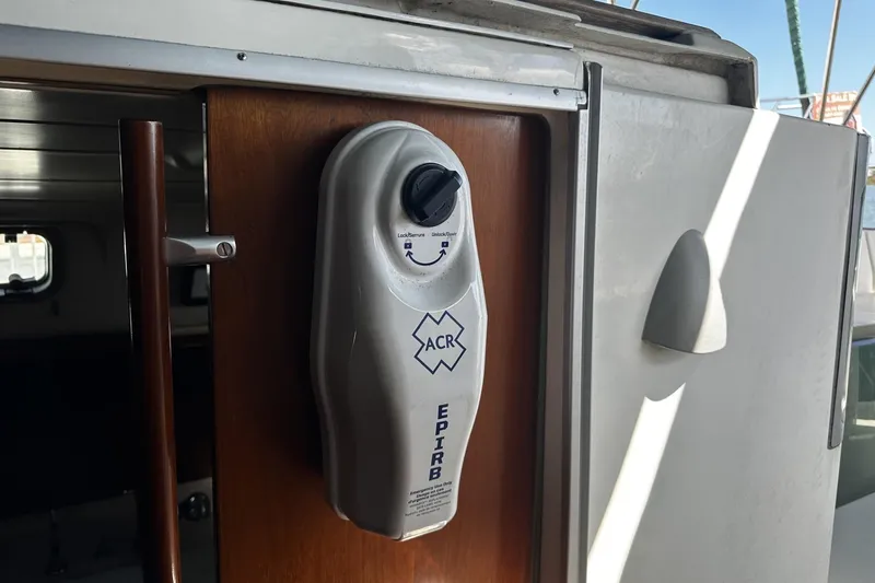Slide: The Image of EPIRB device mounted on 1994 Beneteau Oceanis 400 sailboat interior. - 53