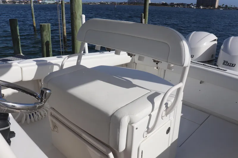 Slide: The Image of White seating area on a 2013 Jupiter 30 boat with ocean view. - 13