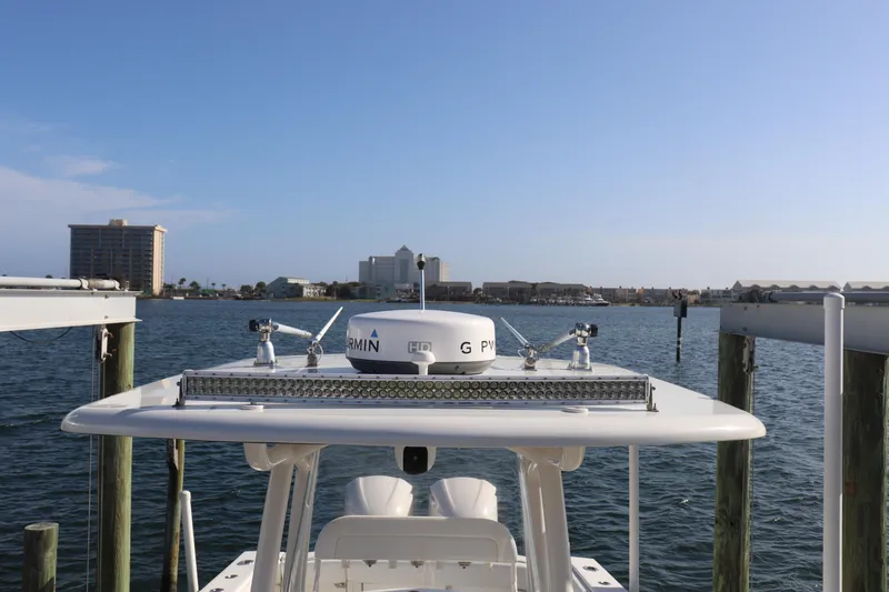 Slide: The Image of 2013 Jupiter 30 boat docked with city skyline in background. - 7