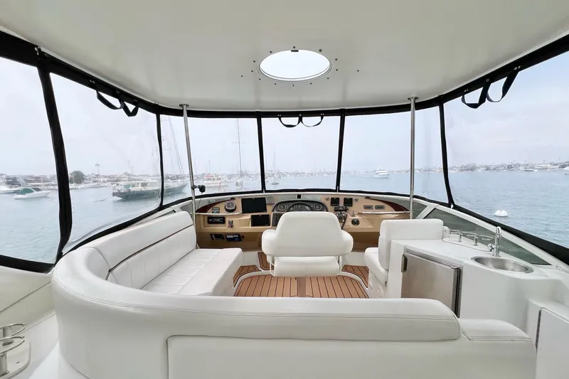Slide: The Image of Interior view of 2003 Carver 444 Cockpit Motor Yacht with luxurious seating and helm. - 11