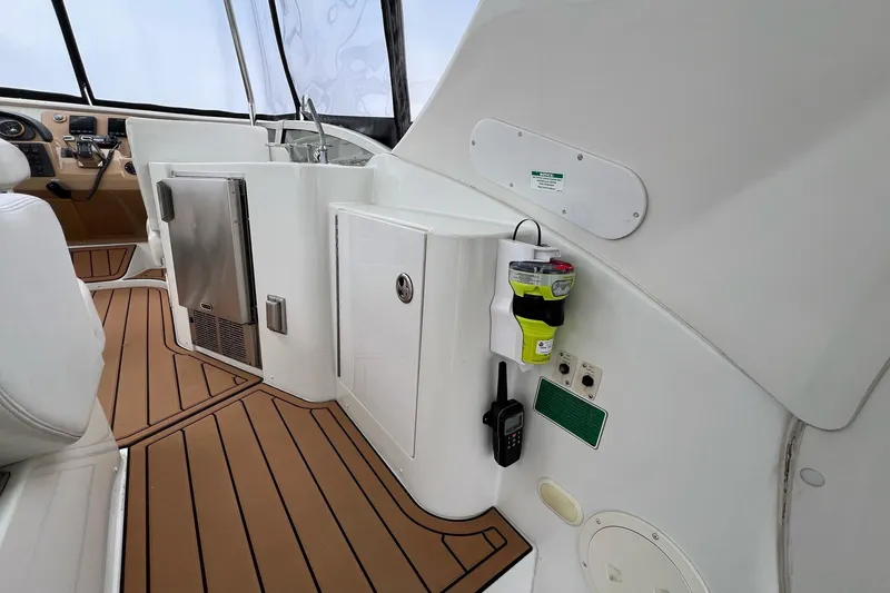 Slide: The Image of 2003 Carver 444 Cockpit Motor Yacht interior with modern amenities and sleek design. - 23