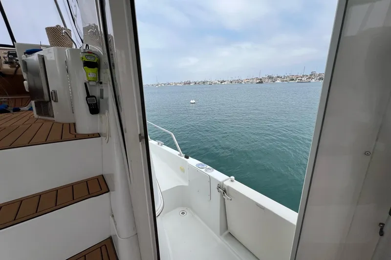 Slide: The Image of 2003 Carver 444 Cockpit Motor Yacht with ocean view from deck. - 28