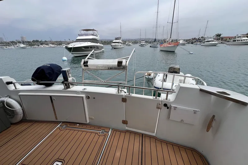 Slide: The Image of 2003 Carver 444 Cockpit Motor Yacht docked in a busy marina. - 36