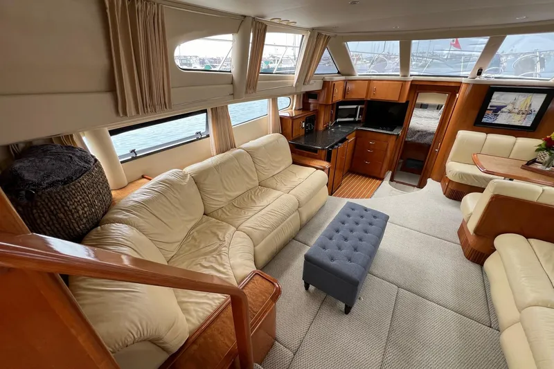 Slide: The Image of Luxurious interior of 2003 Carver 444 Cockpit Motor Yacht with plush seating and elegant wood finishes. - 39