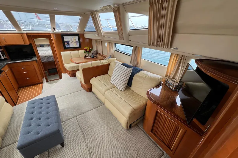 Slide: The Image of Luxurious interior of 2003 Carver 444 Cockpit Motor Yacht with elegant seating and decor. - 40