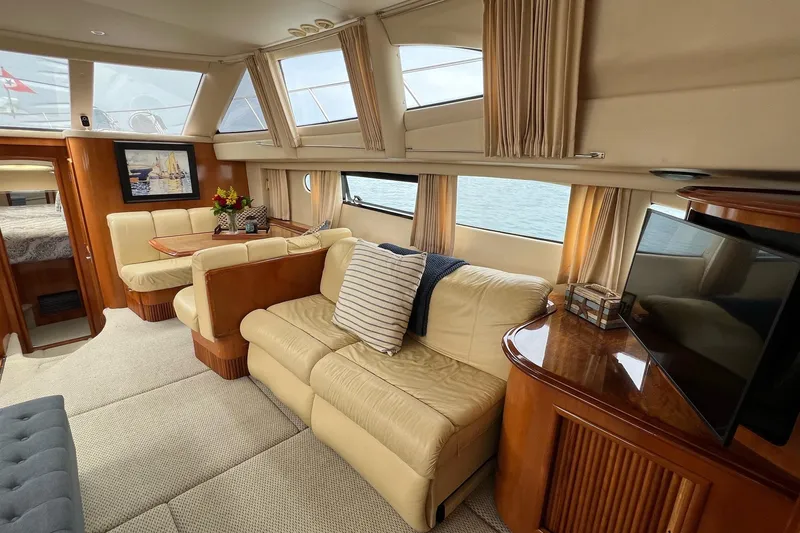 Slide: The Image of Luxurious interior of 2003 Carver 444 Cockpit Motor Yacht with elegant seating and decor. - 41