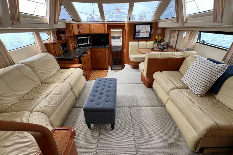 Slide: The Image of Luxurious interior of 2003 Carver 444 Cockpit Motor Yacht with plush seating and elegant decor. - 43