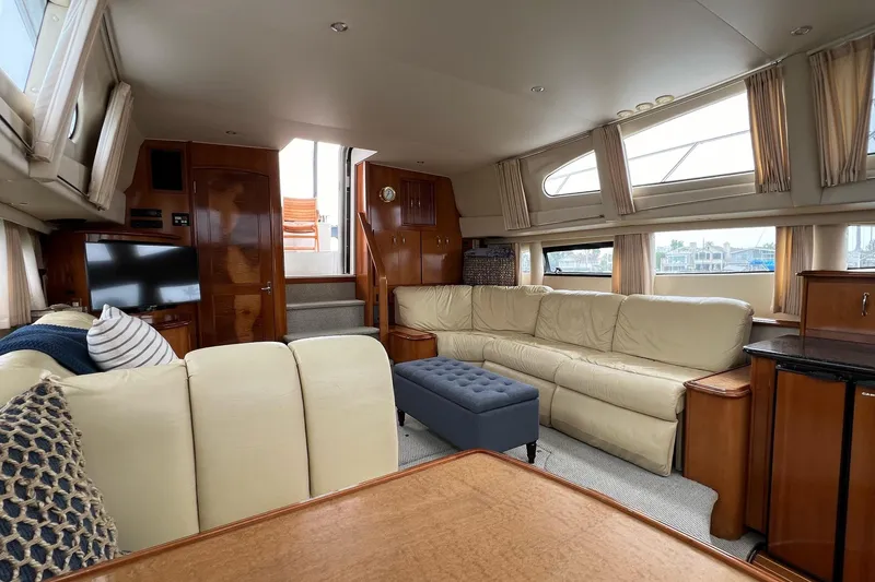 Slide: The Image of Luxurious interior of 2003 Carver 444 Cockpit Motor Yacht with plush seating and elegant decor. - 44