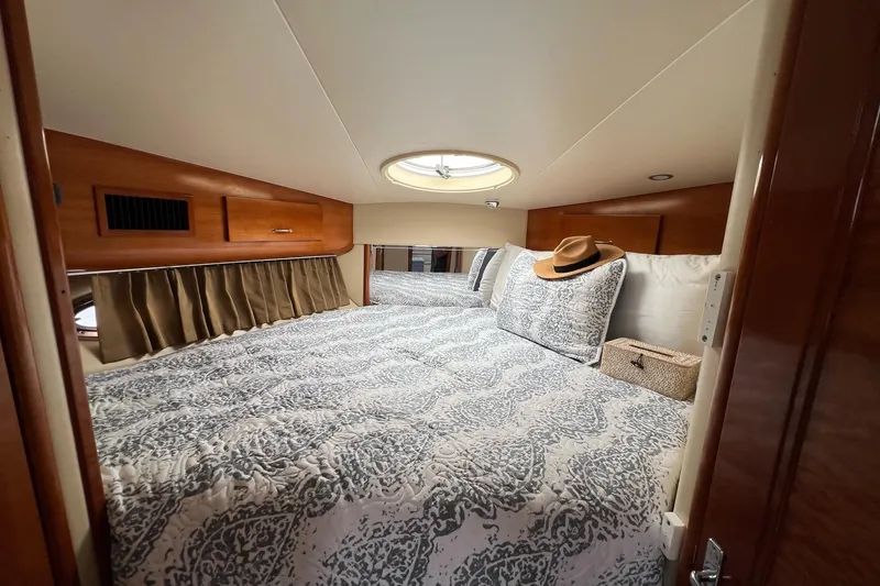 Slide: The Image of Luxurious bedroom interior of 2003 Carver 444 Cockpit Motor Yacht with elegant bedding. - 50
