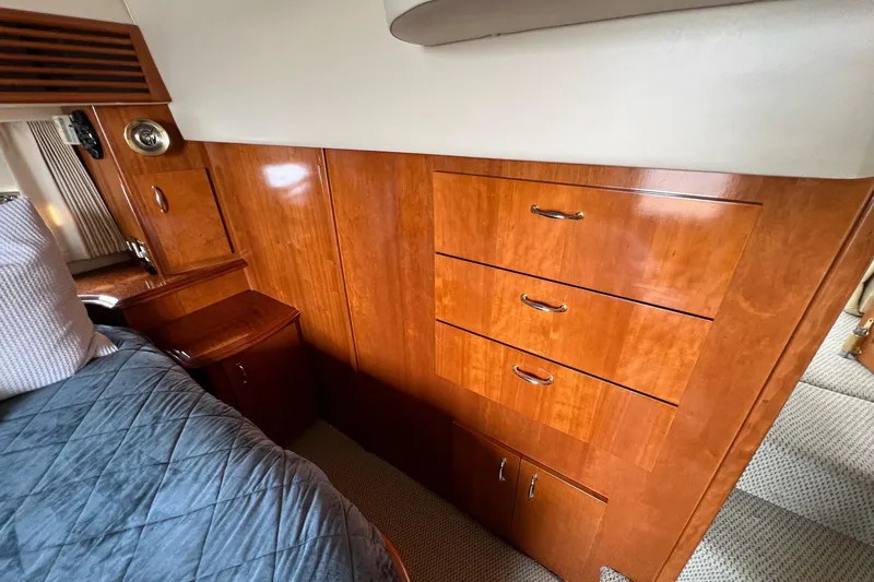 Slide: The Image of Luxurious wood cabinetry in 2003 Carver 444 Cockpit Motor Yacht interior. - 60