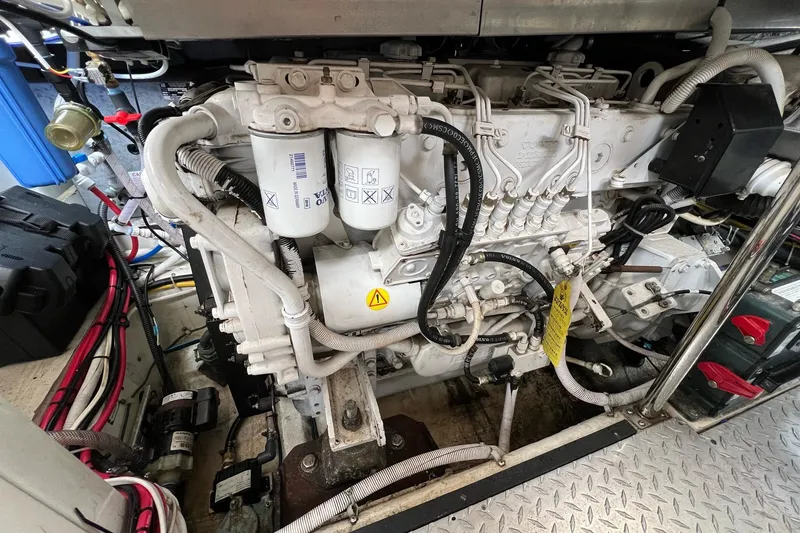 Slide: The Image of Engine compartment of a 2003 Carver 444 Cockpit Motor Yacht, showcasing detailed machinery. - 67
