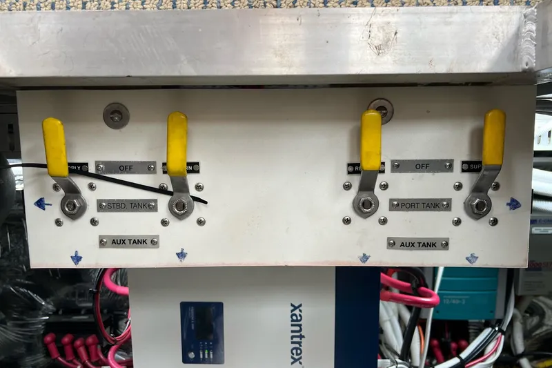 Slide: The Image of Control panel with yellow levers on a 2003 Carver 444 Cockpit Motor Yacht. - 74